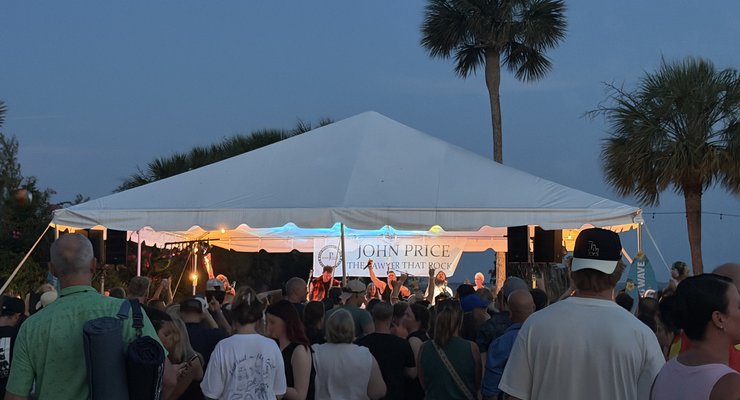 Crowd watching a live band perform under a tent at Party at the Point beachfront concert series, Mount Pleasant SC