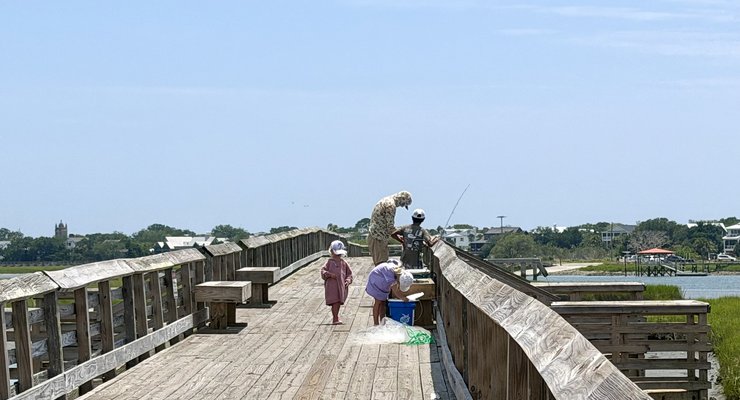 Fishermen at the Pitt Street Bridge pier in Mount Pleasant SC