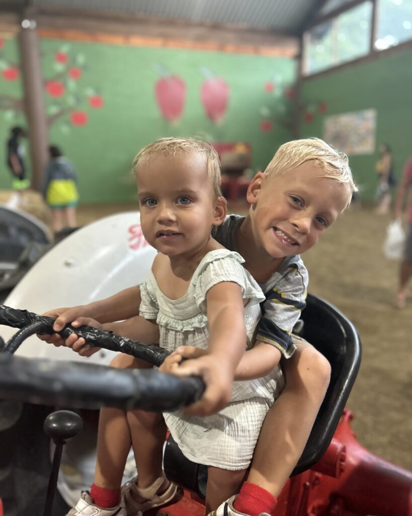 Families enjoying Jeter Mountain Farm's orchard and play area in Hendersonville, NC