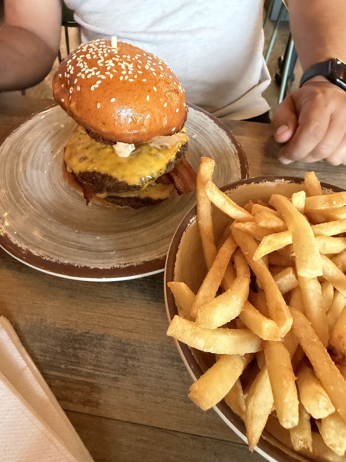 Smash burger with cheesy grit ball on top at Grit Counter in North Charleston SC