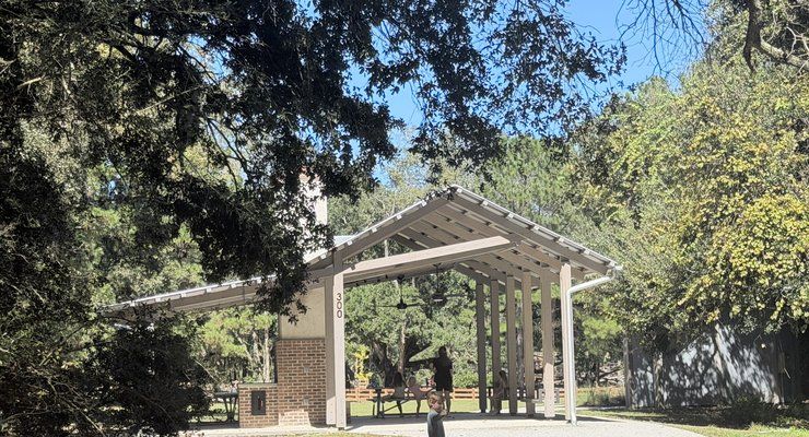 Covered picnic pavilion shaded by live oaks at Old Towne Creek County Park