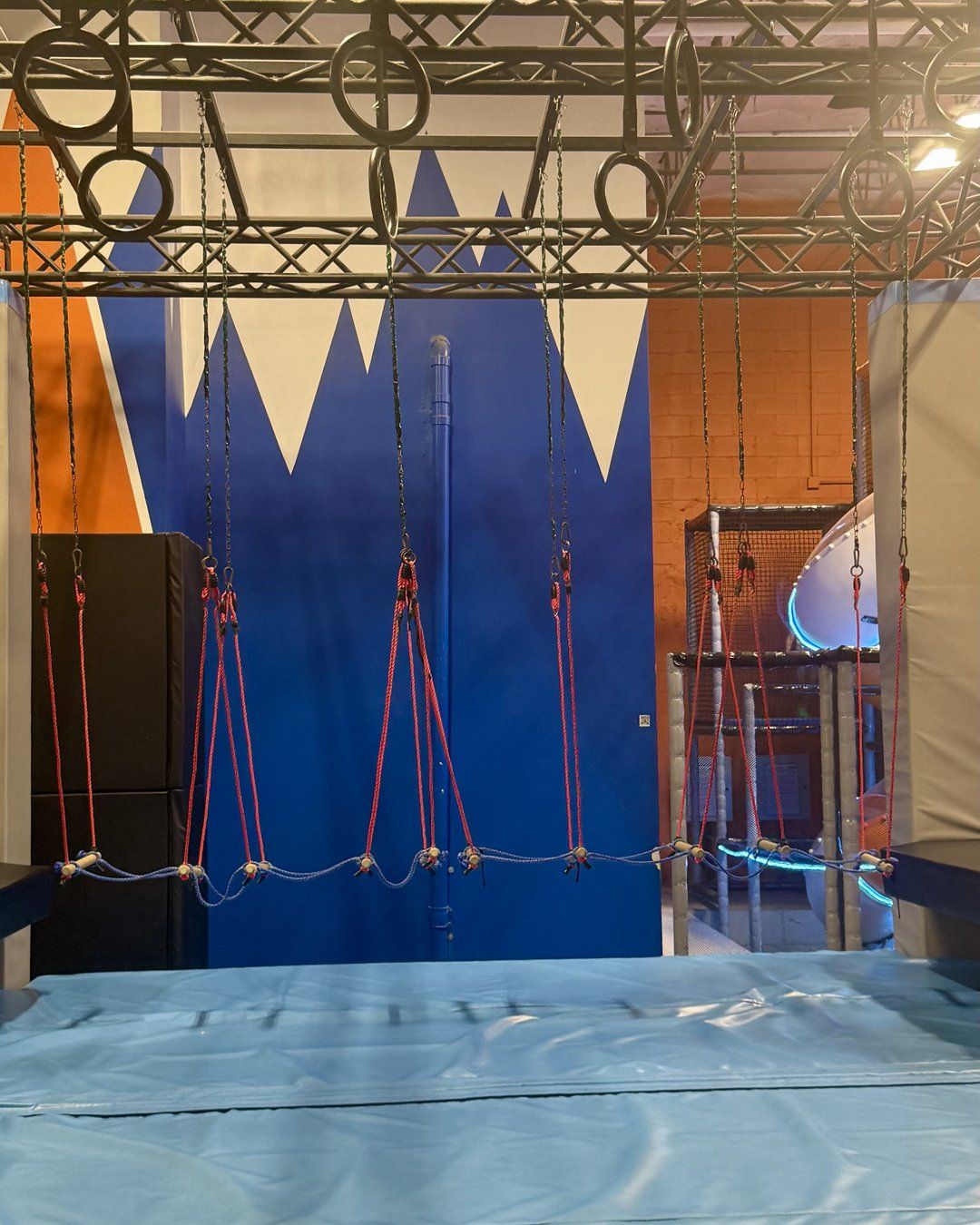 Overhead rings and rope obstacles on the ninja course at Summit Adventure Park in Charleston